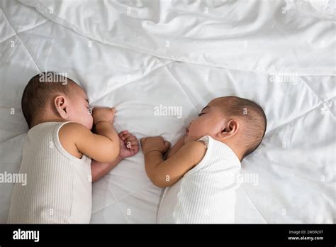 Asian two adorable twin babies boy, Happy childhood Stock Photo - Alamy