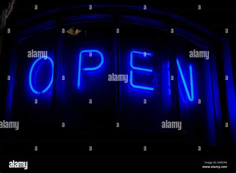 Blue neon OPEN sign Stock Photo - Alamy