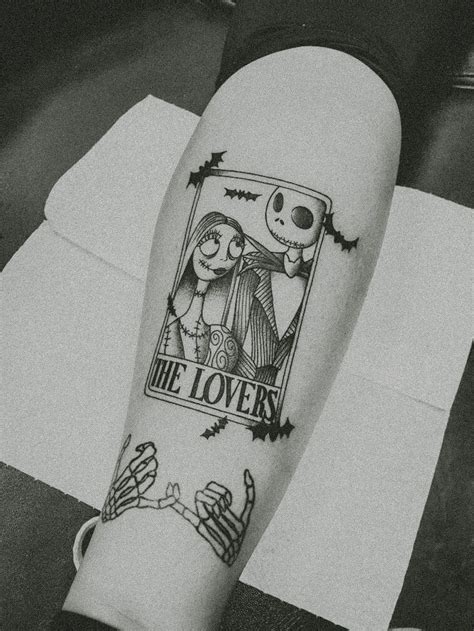 a person with a tattoo on their leg that reads, the love story and ...