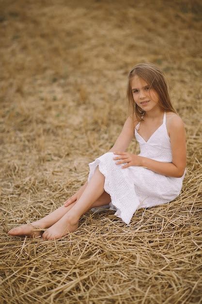 Premium Photo Charming Blonde Girl In Summer Dress Posing On The