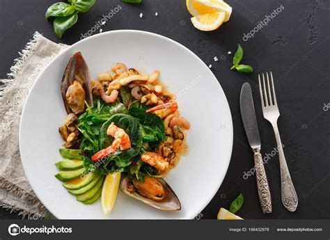 Warm salad with grilled seafood flat lay — Stock Photo © Milkos #166432978