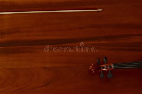 Wooden Violin With Bow On Wooden Floor Top View Classical Musical