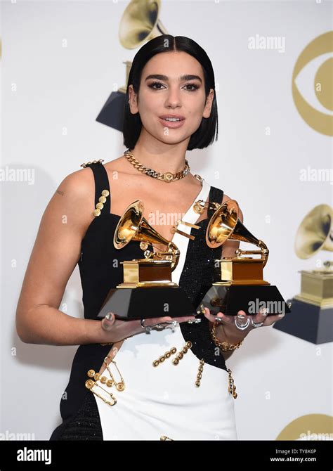 Dua Lipa appears backstage with her awards for Best New Artist and Best ...