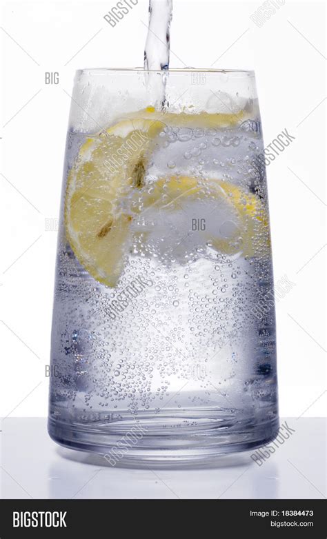 Glass Of Ice Water With Lemon