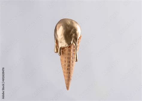 Gold metallic ice cream cone melting isolated on white background Stock ...