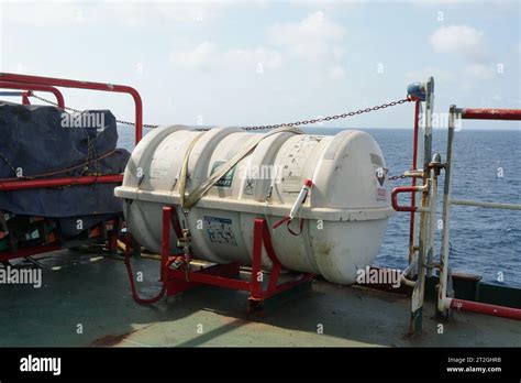 White Life Raft Secured On Deck Of Container Ship Ready For Use In