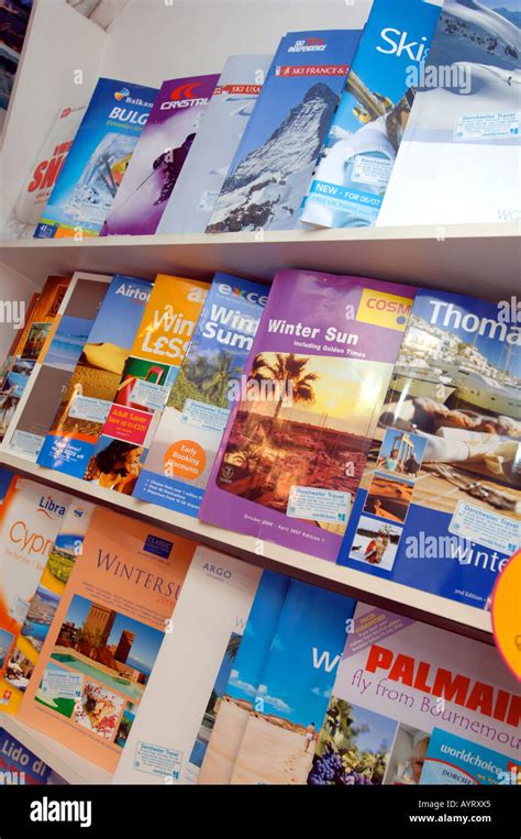 Travel Brochures On Display At Travel Agency Britain Uk Stock Photo