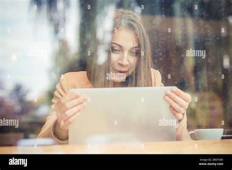 Excited Surprised Woman Looking On Computer Laptop Tablet Screen In