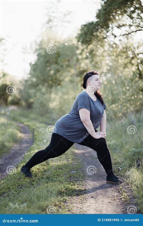 Puffy Woman Stretching Legs at Outdoor Workout Stock Photo - Image of