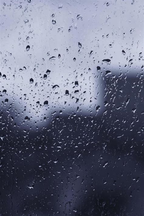 rain drops on glass of window 21624215 Stock Photo at Vecteezy