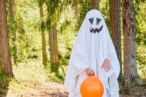 Premium Photo | Funny and scary ghost costume for halloween in the forest