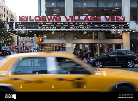 A Yellow Taxi Passing In Front The Amc Loews Village 7 Theater In New