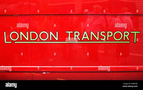 London Transport logo on the side of a red London bus Stock Photo - Alamy