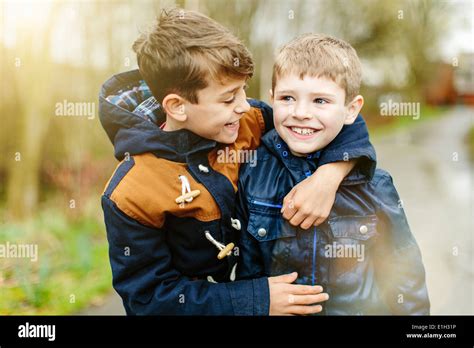 Two Teenage Brothers Hugging