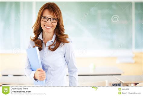 Smiling Teacher Standing In Classroom Stock Image Image Of Green Classroom 33834633