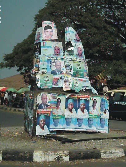 Political campaign posters pasted on Ikare hills' statue in Ikare,Ondo... | Download Scientific ...