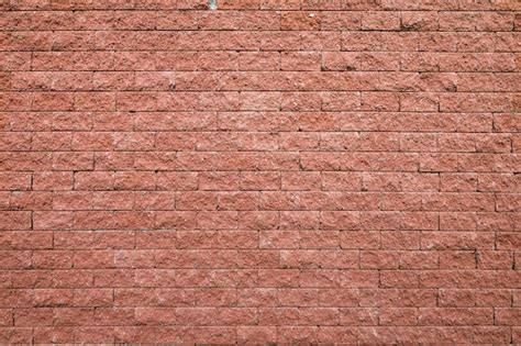 Premium Photo | Red brick wall seamless background