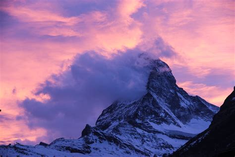 Free Stock Photo of Cloud on Mountain Peak in Purple Sky