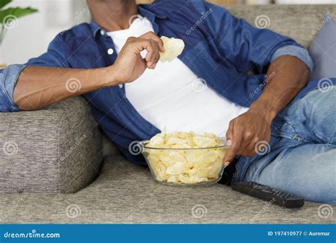 Cropped View Man Eating Snacks while Watching Tv Stock Image - Image of ...