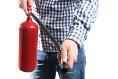 Man Using Fire Extinguisher On White Background Closeup Stock Photo