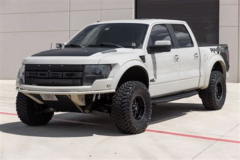 White Ford Raptor Lifted