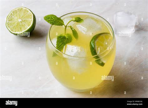 Yellow Lemonade Cocktail with Lime and ice. Beverage Concept Stock ...