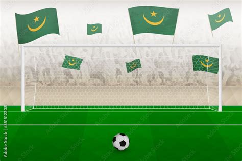 Mauritania football team fans with flags of Mauritania cheering on stadium, penalty kick concept ...