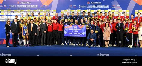 Players Of United States Women S National Volleyball Team Pose With Their Trophy After Winning