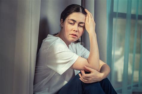 Portrait Of Frustrated Woman Holding Her Head With Her Hand Dark