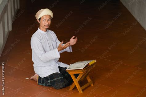 Religious Muslim Islam Man In Brown Session Sit On The Floor And Read