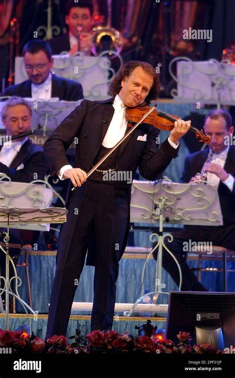 Dutch Pop Violinist Andre Rieu Performs With His Orchestra On Stage