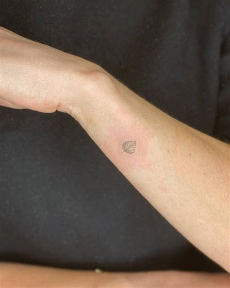 Fine Line Style Aspen Leaf Tattoo Located On The Wrist