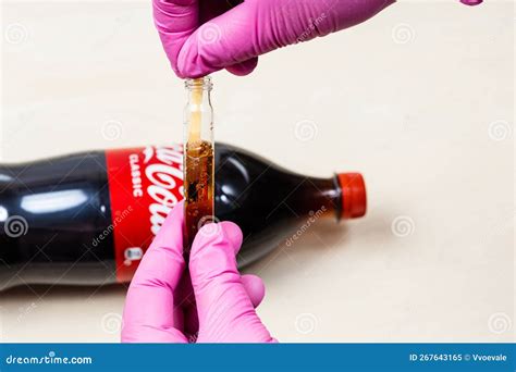 Measuring Of Coca Cola PH Level With Litmus Paper Editorial Image