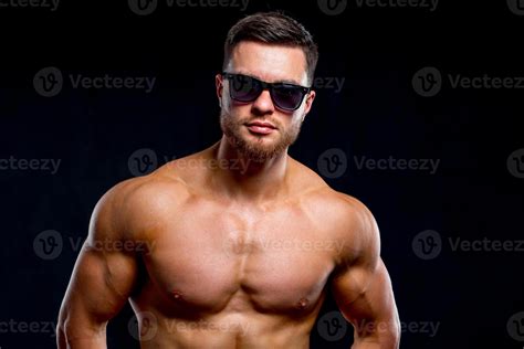 Athletic Man With Naked Torso Posing In Studio Portrait Of A Handsome