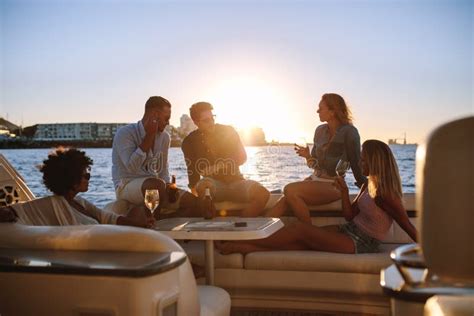 Group Of Friends Partying On Yacht At Sunset Stock Image Image Of