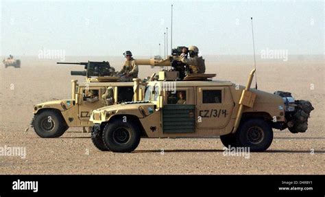 Humvee military vehicles of the US Marine, armed with heavy machine ...