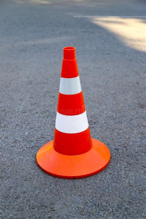 An Orange Traffic Cone on the Road Stock Photo - Image of urban ...