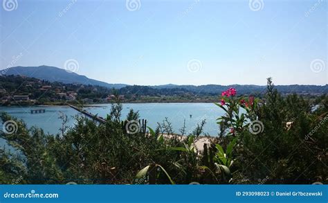 A Glimpse Of The Sea Through The Foliage With Distant Views Revealing