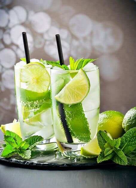 Premium Ai Image Cold Mojito Cocktail With Rum Lime Ice Cubes And Mint