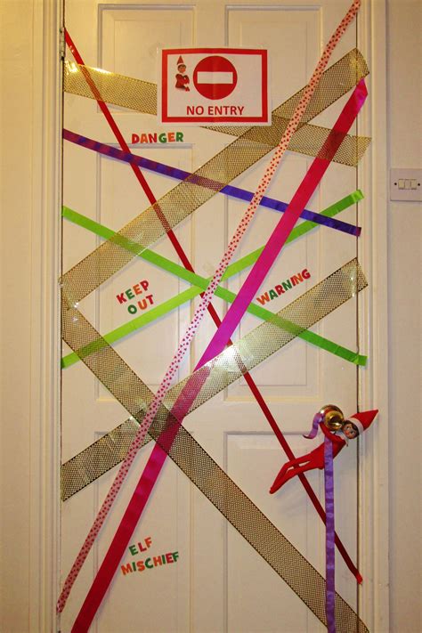 Elf On The Shelf Tapes Up The Door