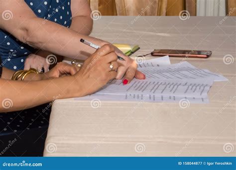 Cropped Image Of Women Signing A Contract Stock Image Image Of