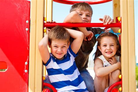 Three Elementary Aged Children In The Playground Sproutlings Childcare