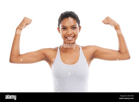 Showing Off Her Muscles A Young Woman In Gym Clothes Flexing Her Arms