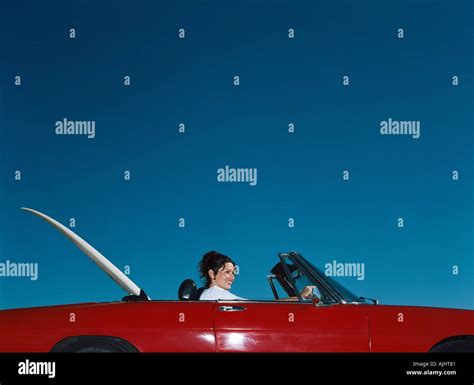 Woman driving convertible Stock Photo - Alamy