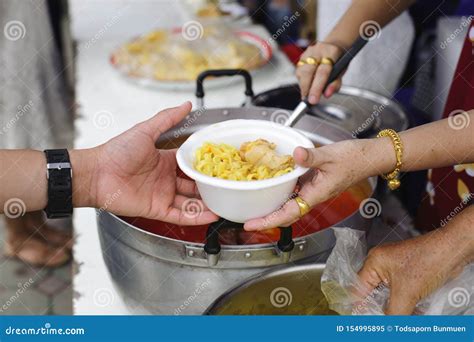 Charity Food Is Free For People In Slums Hands Of Volunteers Serves