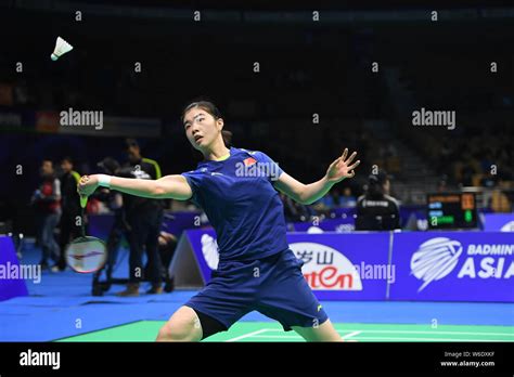 Gao Fangjie Of China Returns A Shot To Nozomi Okuhara Of Japan In Their