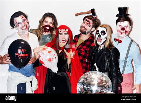 Friends in creepy Halloween costumes, portrait Stock Photo - Alamy