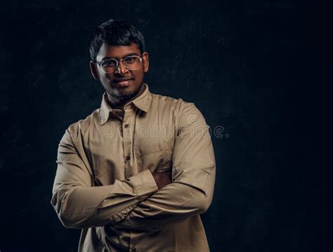 Handsome Dark Skinned Guy Smiles And Crossed His Arms Stock Photo