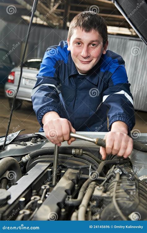 Happy Automotive Mechanic At Work With Wrench Stock Photo Image Of