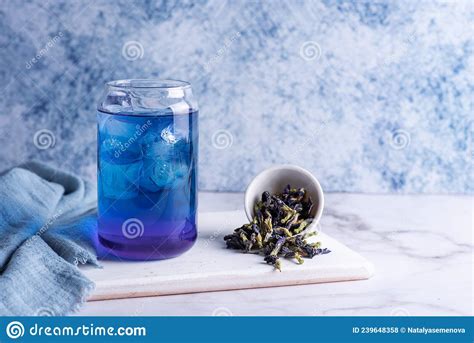 Glass Of Blue Anchan Iced Butterfly Pea Flower Tea And Dry Clitoria